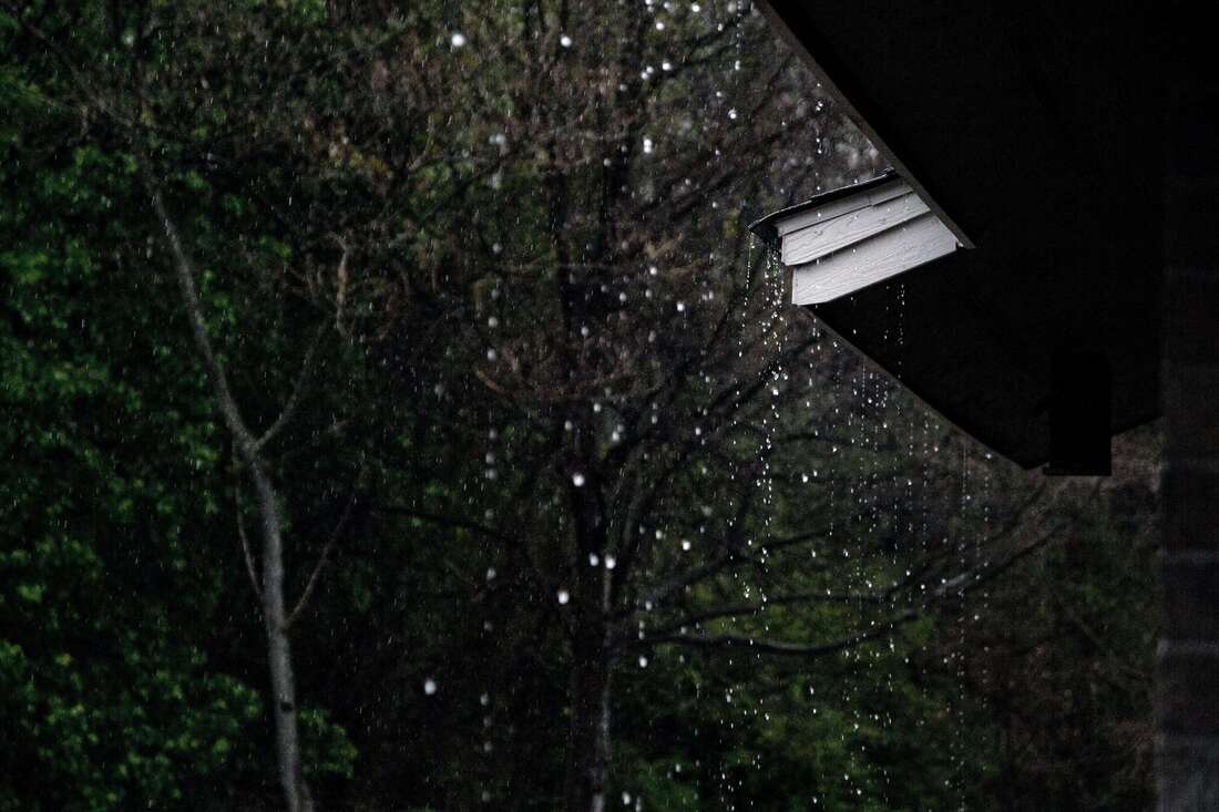 Heavy rain falling off Orlando area home